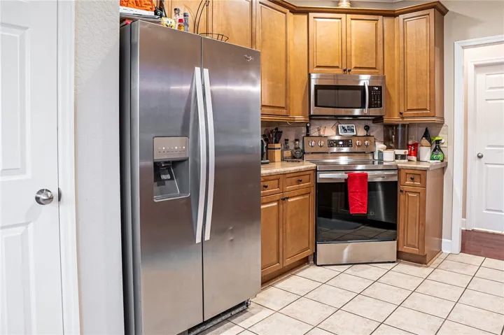 Culinary space featuring stainless steel appliances and ample cabinetry.