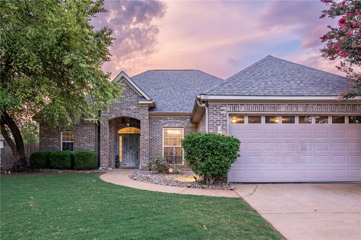 A well-maintained brick facade and an inviting entry set the stage for this charming residence.