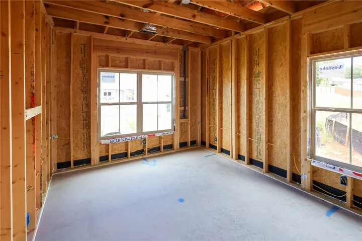 Exposed framing and concrete subfloors mark the beginning stages of this customizable interior space.