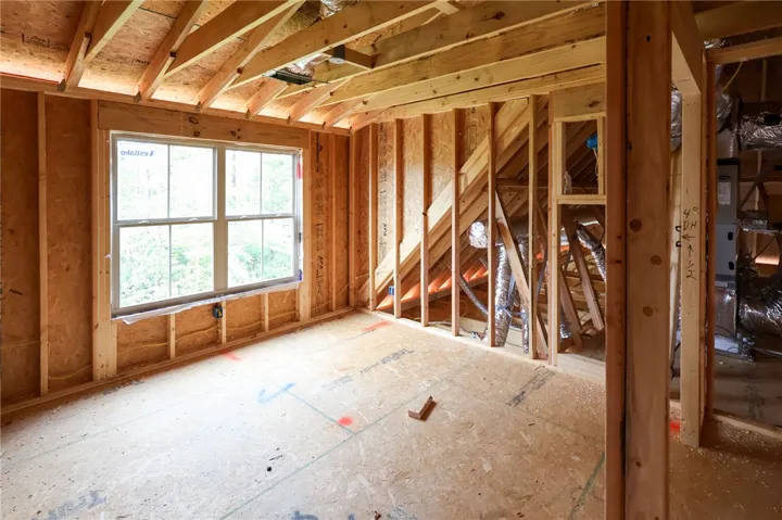 Exposed framing and subflooring define this unfinished space awaiting your custom selections.