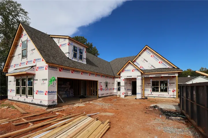 Gabled rooflines and framed openings promise a classic design for this new construction residence.
