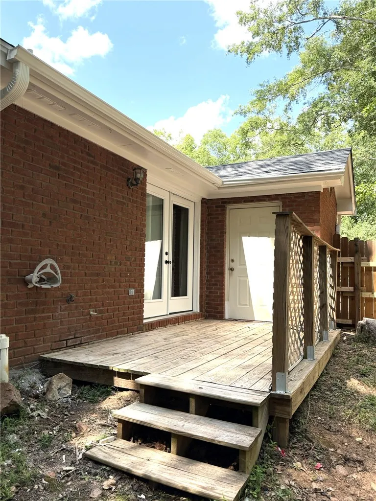 An inviting deck offers seamless outdoor access, perfect for relaxed entertaining.