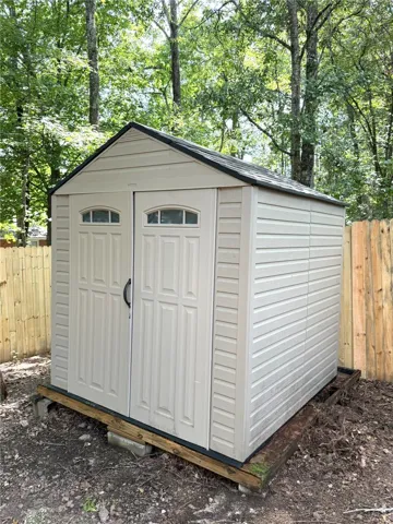 A newly installed shed provides convenient outdoor storage.