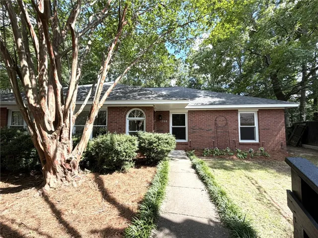 A classic brick exterior offers timeless curb appeal and a welcoming front walk.