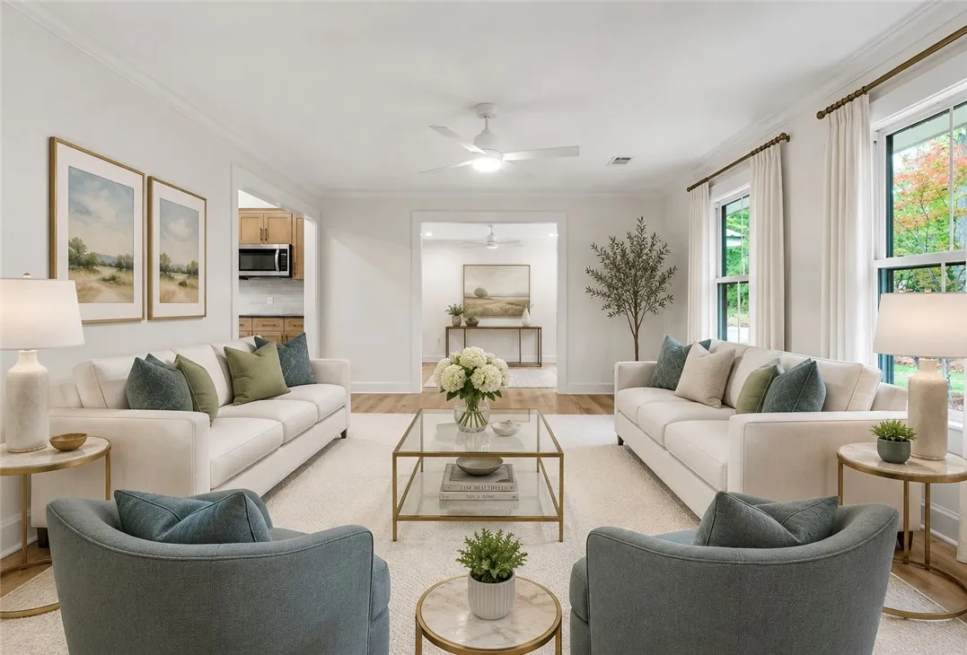 Natural light floods this inviting living space, connecting seamlessly to the kitchen and beyond.