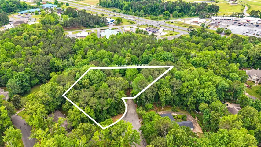 A verdant, expansive parcel offering privacy and mature trees, conveniently located near urban amenities.