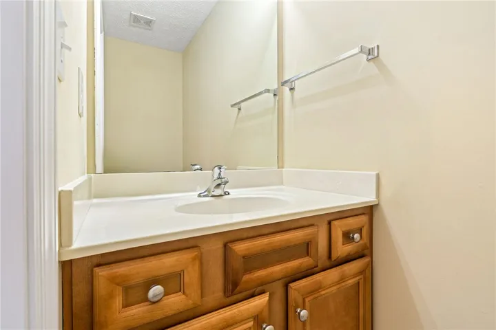 A well-maintained bathroom vanity with ample storage and a sleek, contemporary sink.