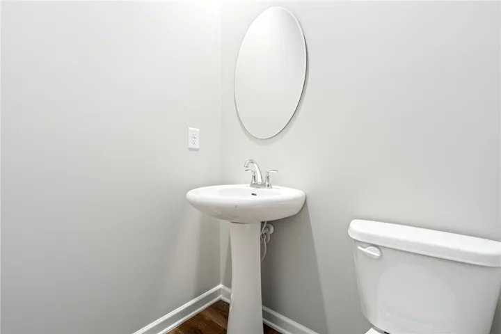 Clean lines and classic fixtures define this minimalist powder room.