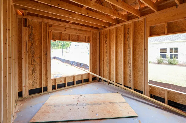 Exposed wood framing and subfloors highlight the solid craftsmanship of this ongoing residential build.