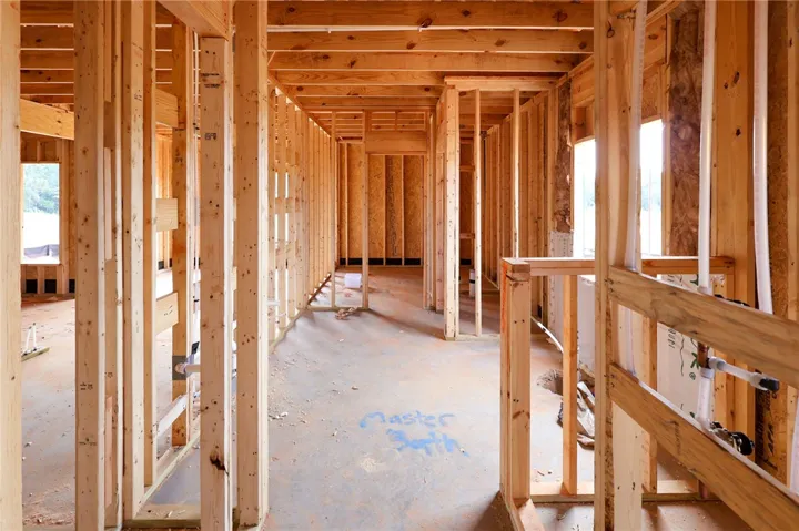 Exposed wood framing outlines the future layout of a customizable interior space.