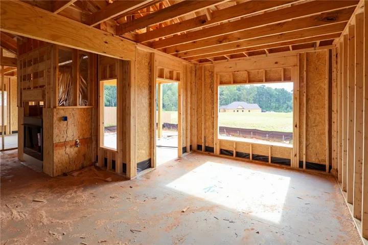 Wood framing and exposed joists define this promising residential build in progress.