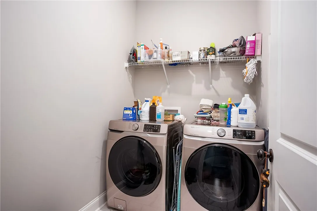 A dedicated laundry room with washer and dryer units for effortless home care.