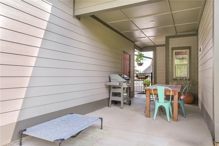 A tranquil covered patio offers an ideal space for outdoor relaxation and entertaining.