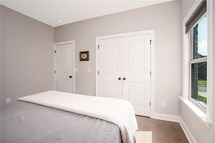Well-lit sleeping quarters with a window offering ample natural light.