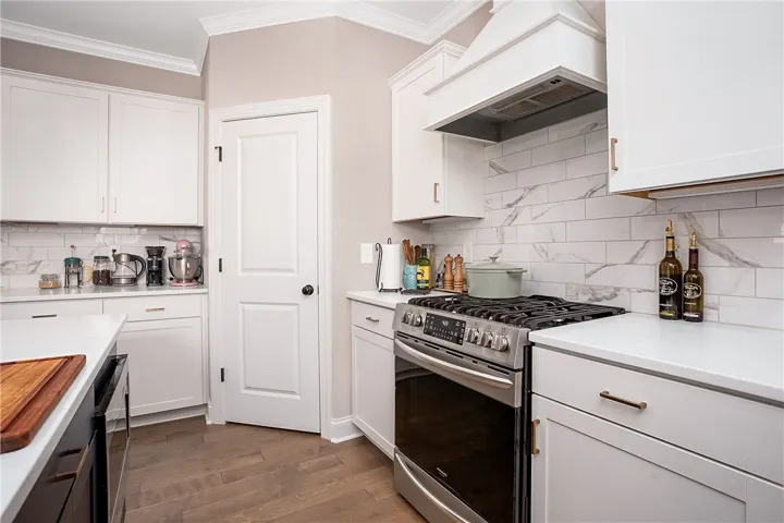 Culinary delights await in this bright kitchen, complete with modern appliances and ample counter space.