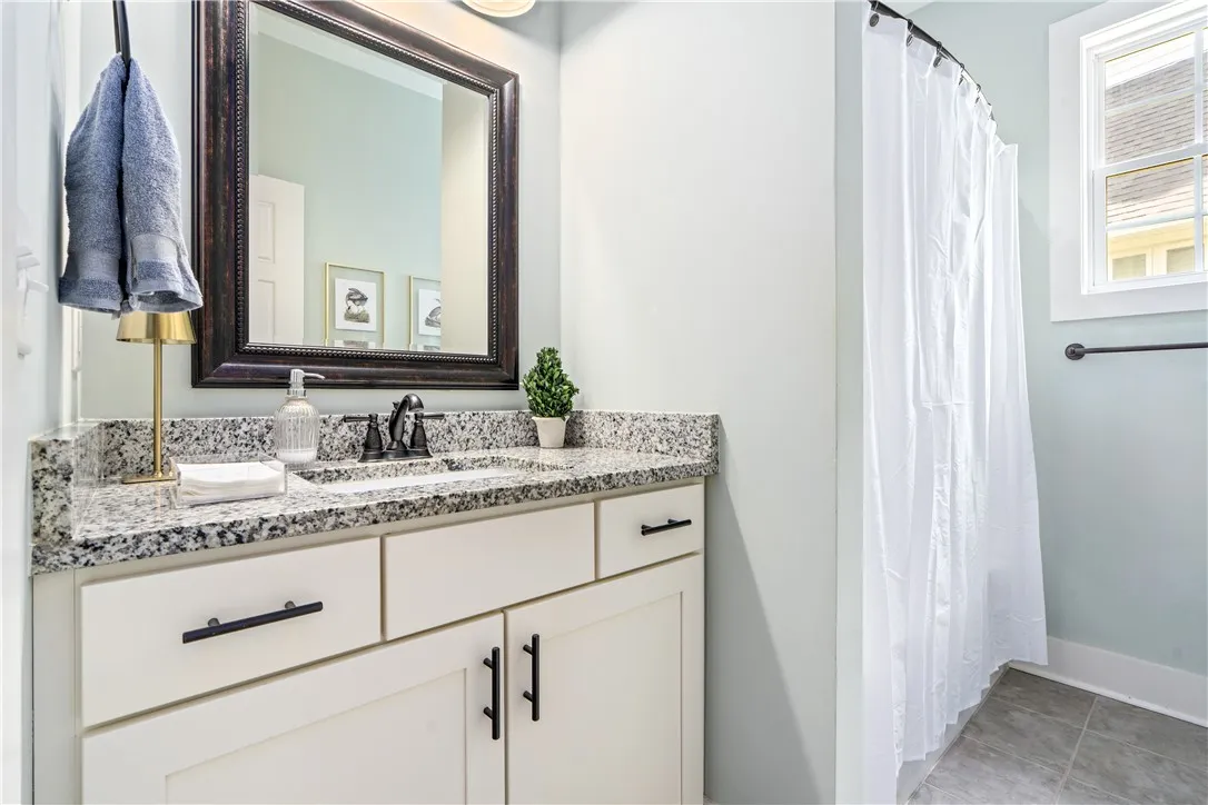 Hall/guest bath located in between bedrooms 2 and 3.