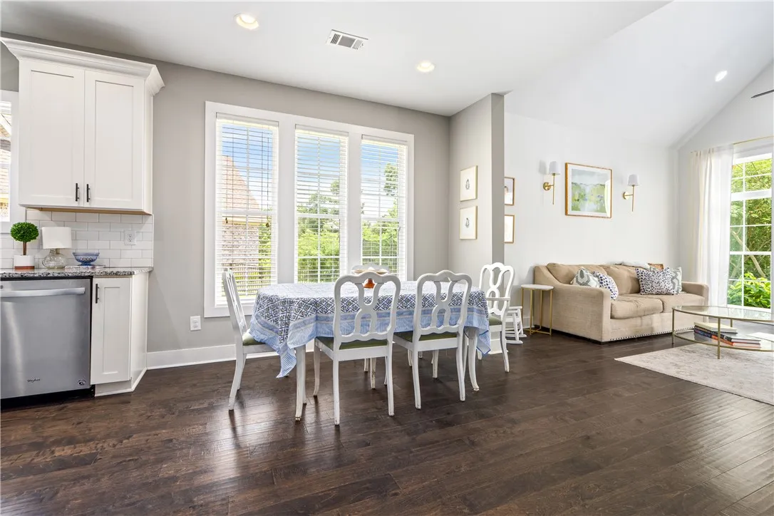 The dining area connects the kitchen and the living area.