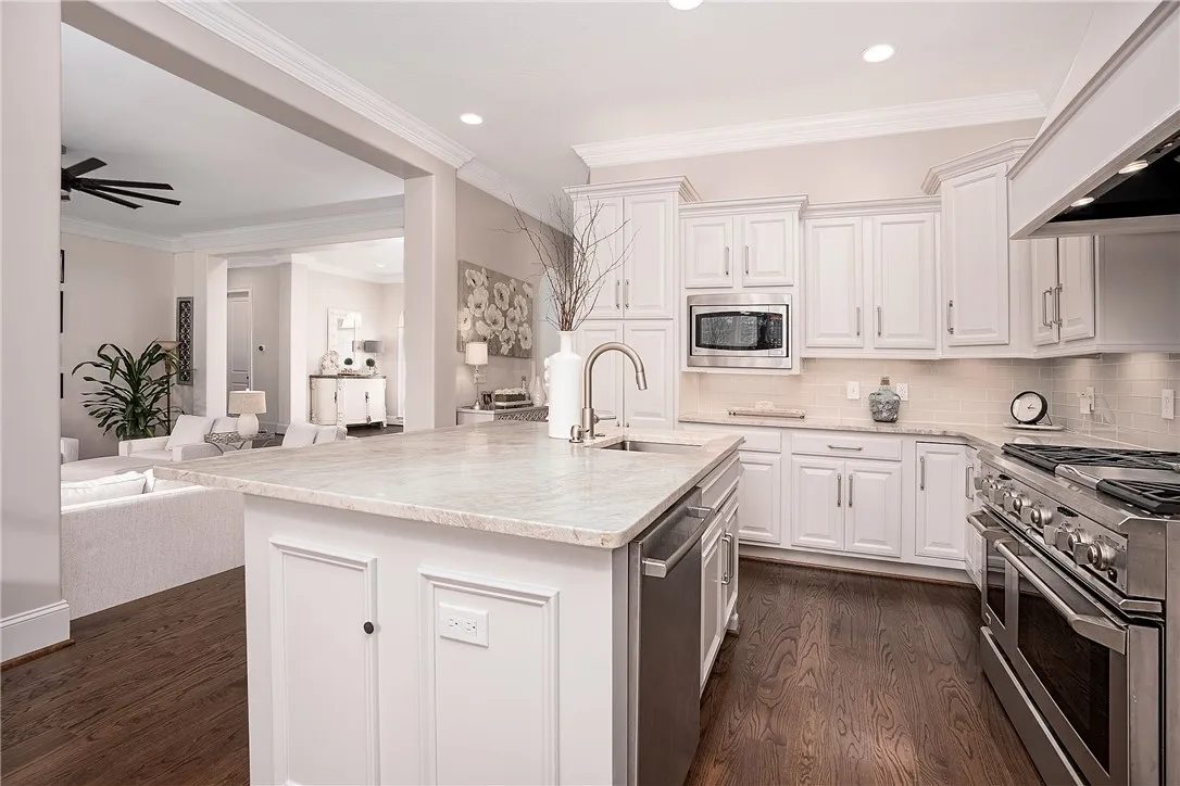 Culinary creations come to life in this kitchen, complete with a generous island and sleek appliances.