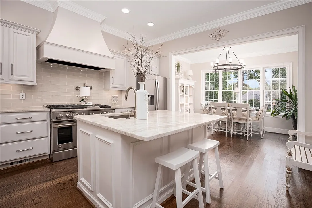 Culinary delights await in this bright kitchen with an inviting dining area.