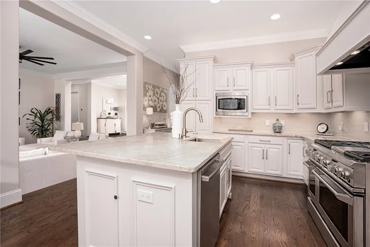 Culinary creations come to life in this kitchen, complete with a generous island and sleek appliances.