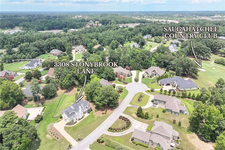 An aerial perspective reveals a prime residence nestled within a verdant, well-established neighborhood.