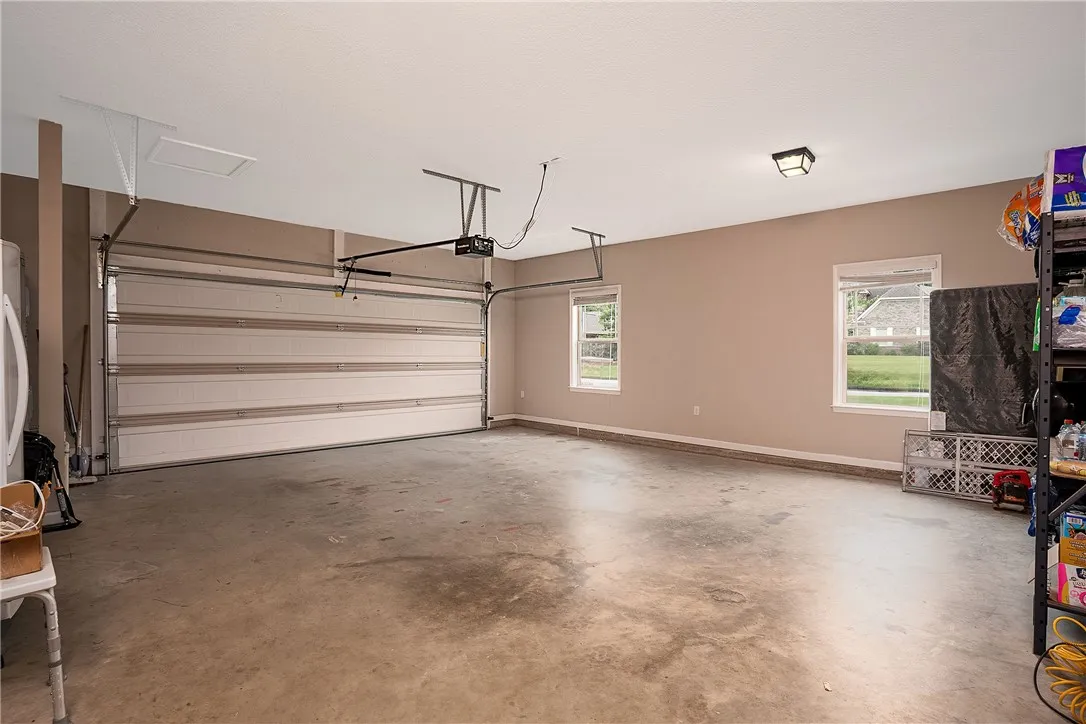 Ample space for vehicles and storage with convenient windows for natural light.