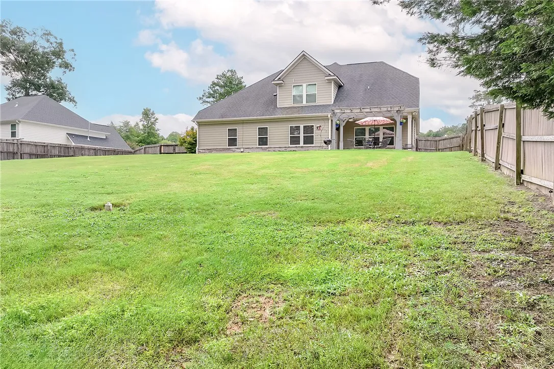 A generously sized yard provides ample space for recreation and outdoor enjoyment.
