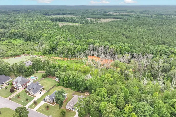 Vast, verdant woodlands surround a tranquil residential enclave with private pools.