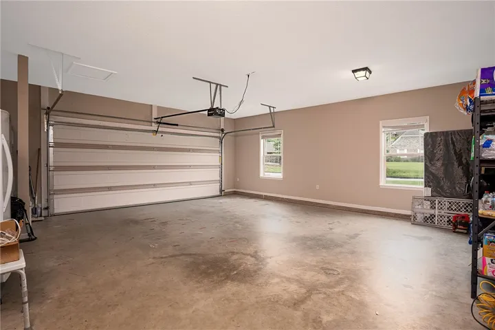 Ample space for vehicles and storage with convenient windows for natural light.