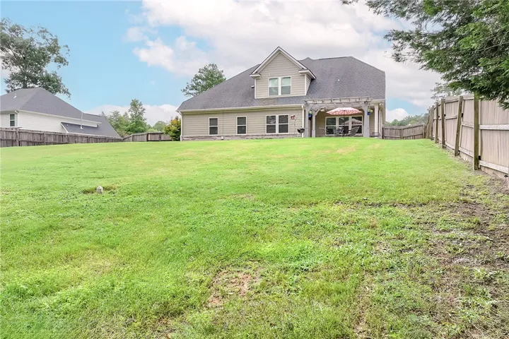 A generously sized yard provides ample space for recreation and outdoor enjoyment.