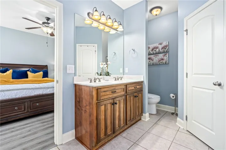 Double vanity in this primary bathroom offers ample counter space and dual sinks for effortless morning routines.