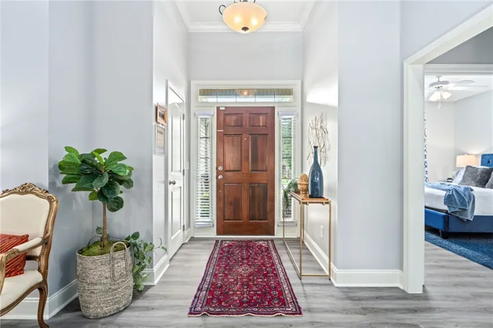 A welcoming entryway with durable flooring extends to a comfortable private area.