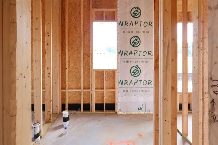 Exposed wood framing and concrete subfloors mark the beginning stages of this custom interior space.