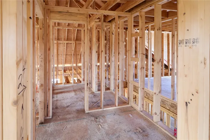 Exposed wood framing outlines the interior layout during the construction phase.