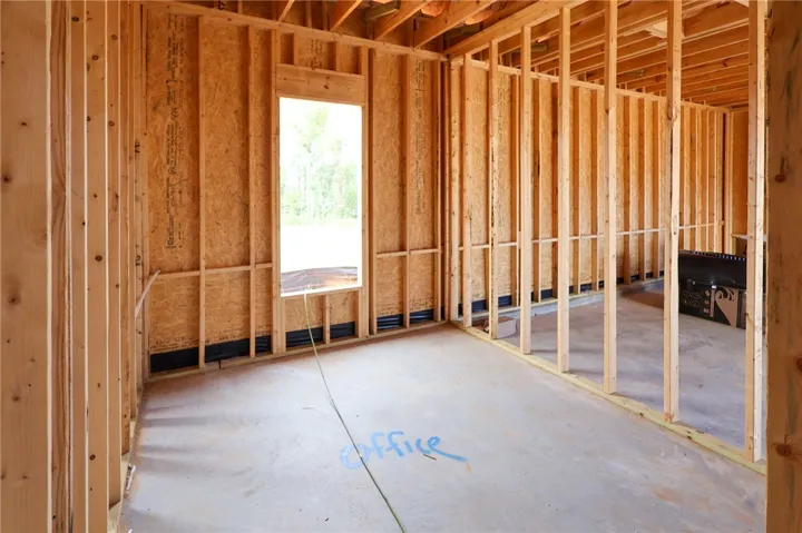 Sturdy wood framing and concrete subfloors mark the beginning of a customizable interior workspace.