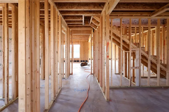 Sturdy wood framing and concrete subfloors mark the beginning of a custom residential design.