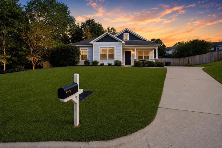 paved driveway welcome you to this inviting home