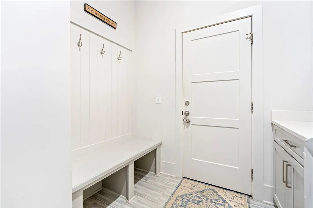 Mudroom area leading to double garage
