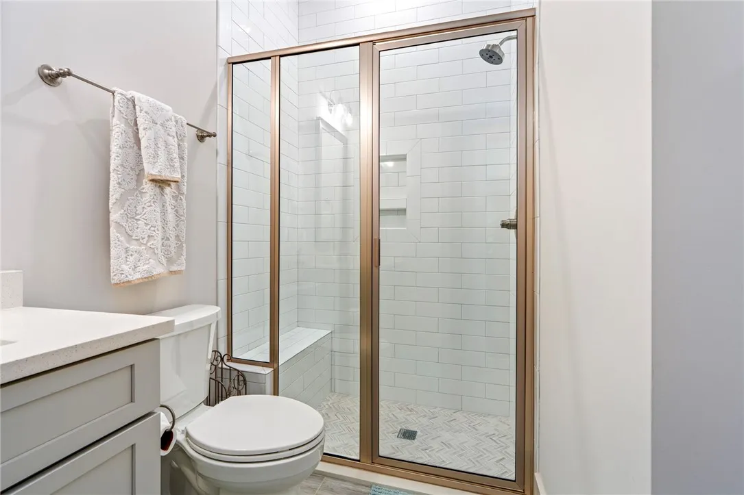 Hallway full bath with glass shower