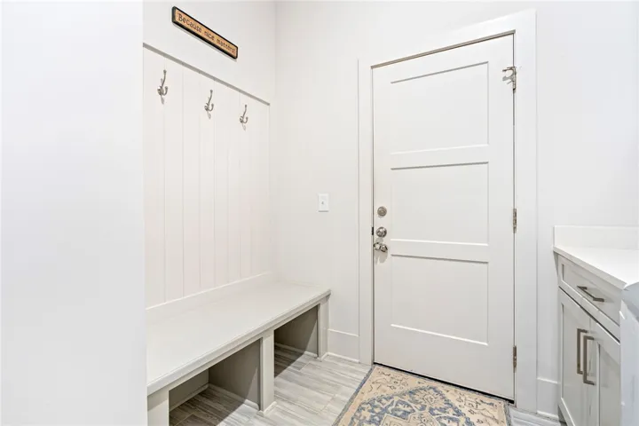 Mudroom area leading to double garage