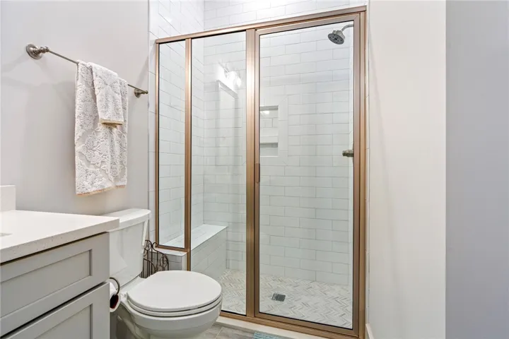 Hallway full bath with glass shower