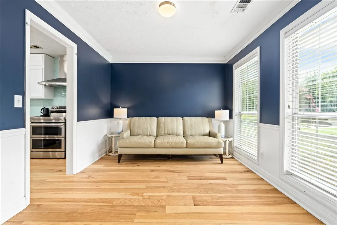 Hardwood floors and vibrant accent walls create an inviting space, perfect for everyday living.