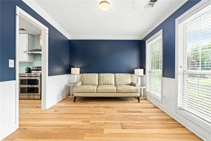 Hardwood floors and vibrant accent walls create an inviting space, perfect for everyday living.