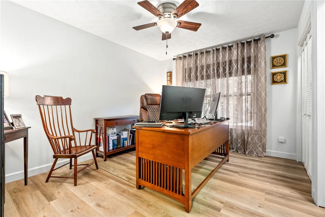 A dedicated home office provides a quiet workspace with ample natural light.