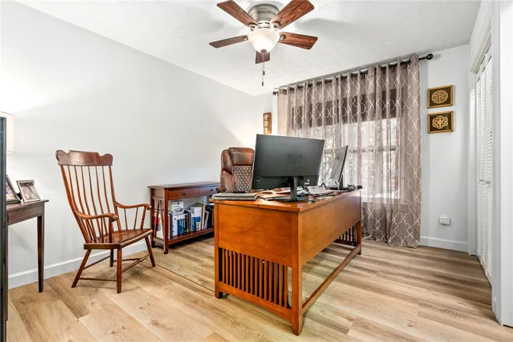 A dedicated home office provides a quiet workspace with ample natural light.