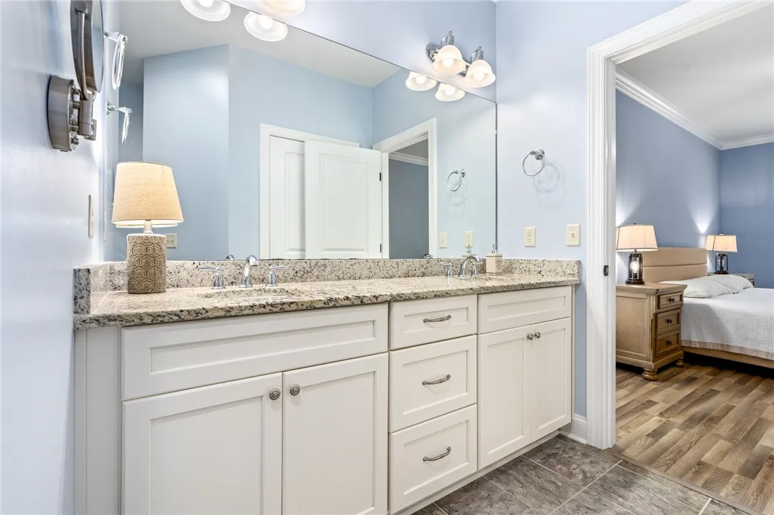 Double vanity with ample counter space creates a functional and pleasing primary bathroom.