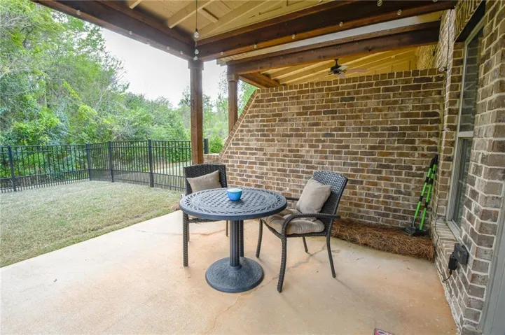 A private outdoor patio offers a comfortable retreat with ample space for entertaining and relaxation.