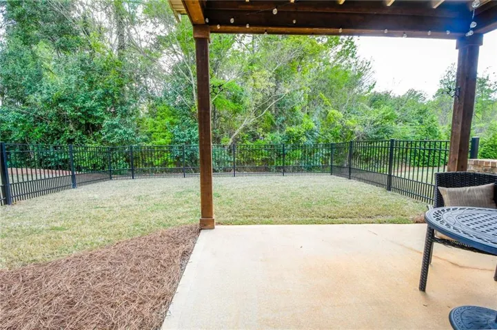 A spacious, enclosed yard provides a private outdoor retreat.