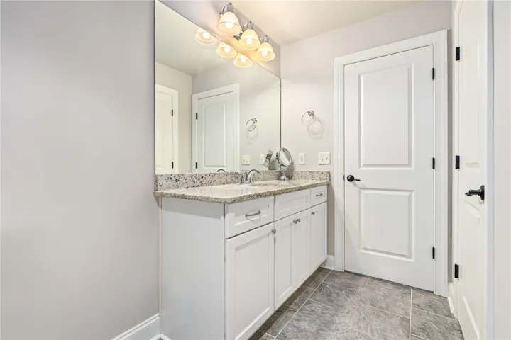 Upstairs bathroom is extra roomy.