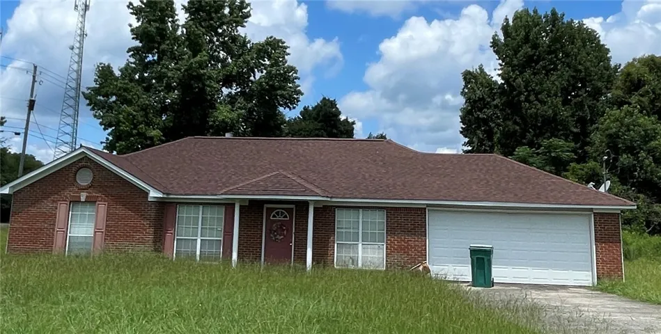 A classic brick exterior with a garage and inviting front porch awaits your personal​​‌​​​​‌​​‌‌​‌‌​​​‌‌​‌​‌​‌​​​‌​​ touch.